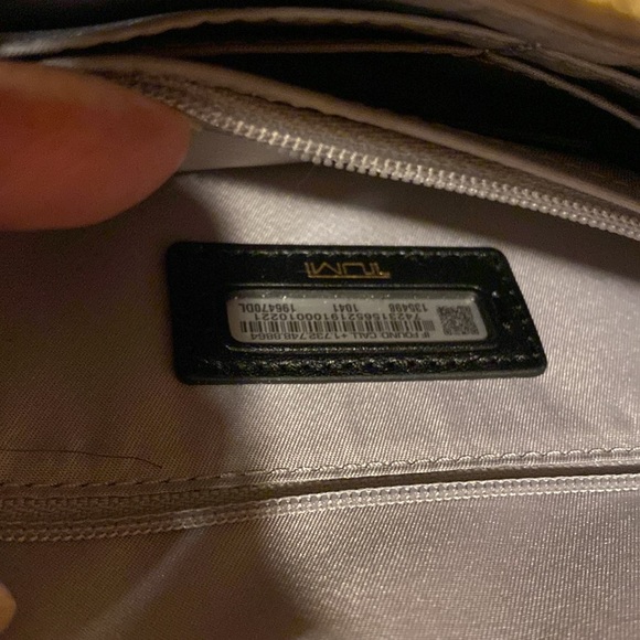 Tumi crossbody bag.
Length is 8.5 inches 
Height is 5.5 inches - Picture 7 of 15